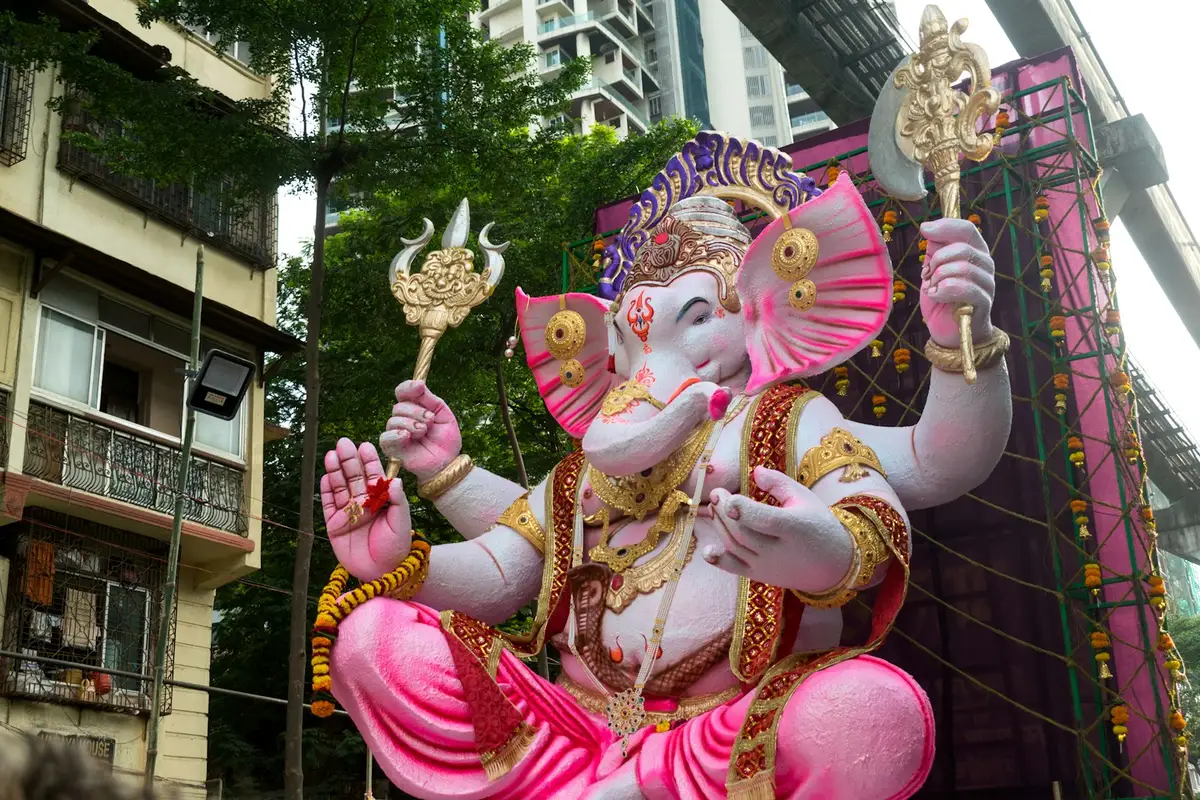 A Ganesha idol arriving in a street procession in Mumbai