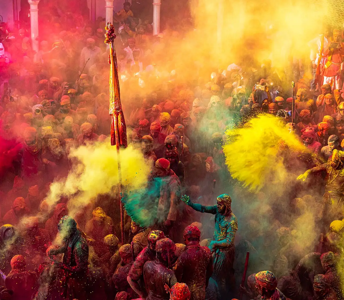 Clouds of coloured powder at Lathmar Holi in Nandgaon, Braj, 2022