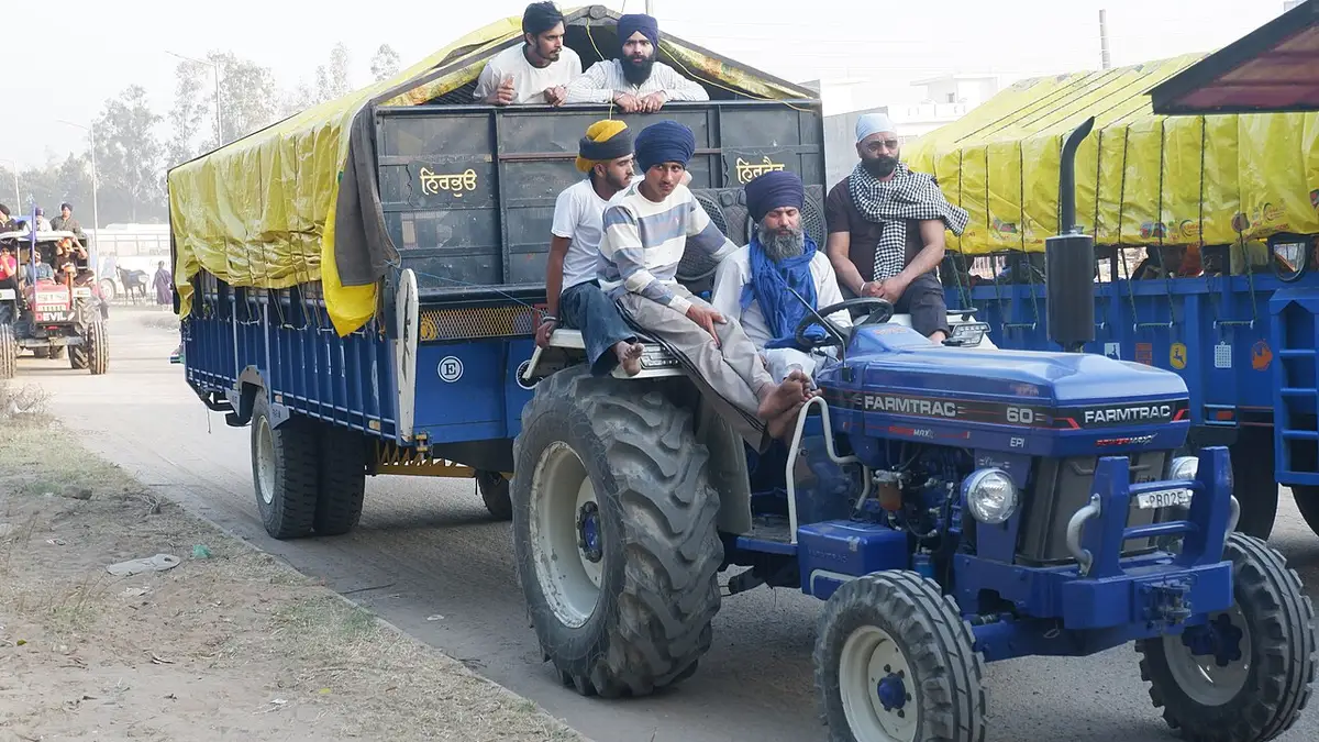 Sikh pilgrims riding a tractor trolley at Hola Mohalla 2026